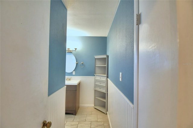 bathroom featuring tile patterned floors and vanity