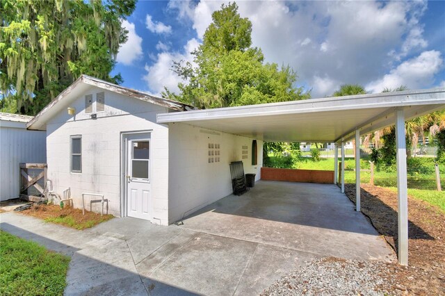 view of vehicle parking featuring a carport