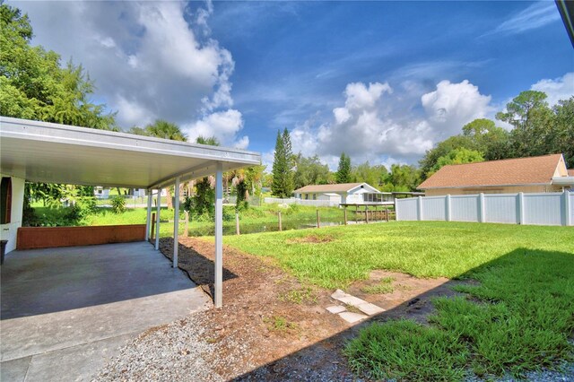 view of yard with a carport