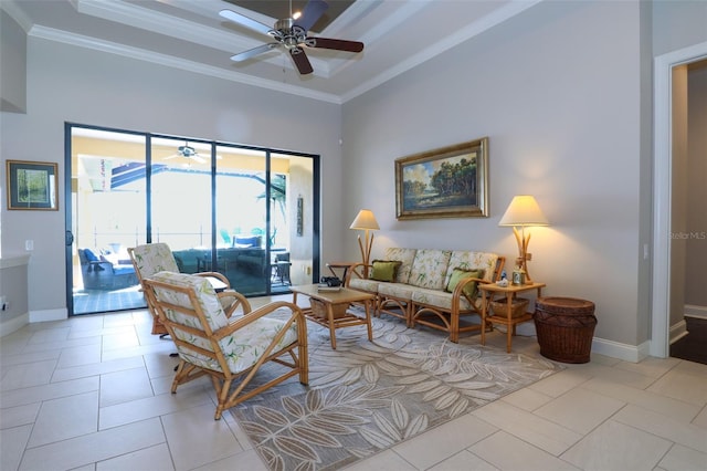 living room with ceiling fan, baseboards, and crown molding