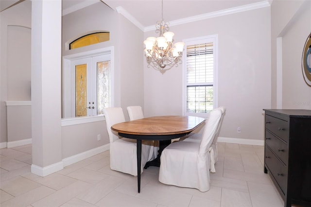 dining room featuring ornamental molding, a chandelier, and baseboards