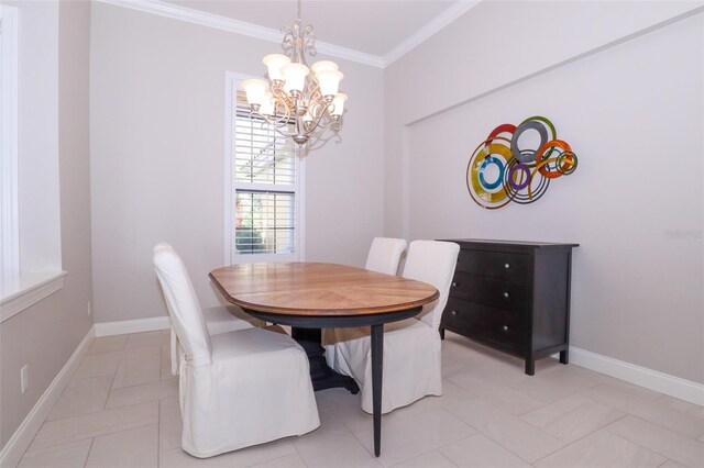 tiled dining room with a chandelier and ornamental molding