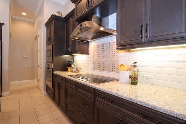 kitchen with under cabinet range hood, appliances with stainless steel finishes, backsplash, light stone countertops, and crown molding