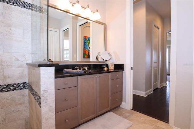 bathroom featuring hardwood / wood-style flooring and vanity