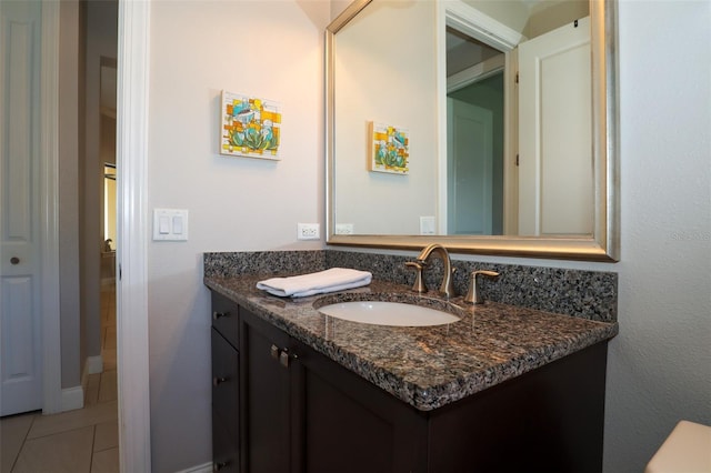 bathroom with tile patterned flooring and vanity