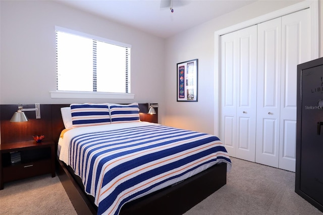 bedroom with carpet flooring and a closet