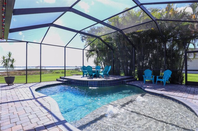 view of pool featuring a lanai, a patio area, and pool water feature