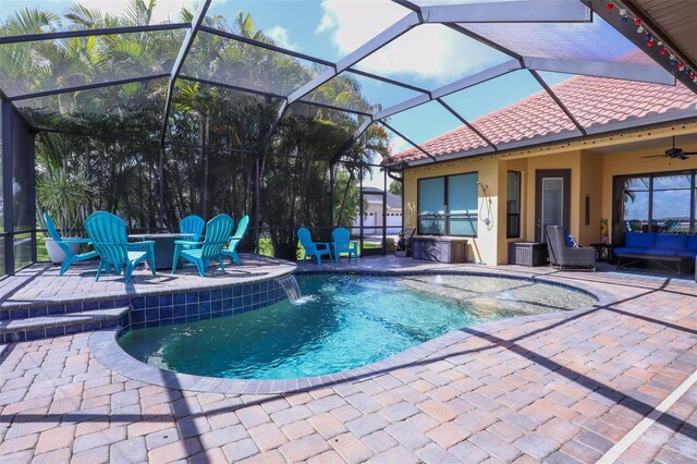 view of swimming pool with glass enclosure, pool water feature, and a patio