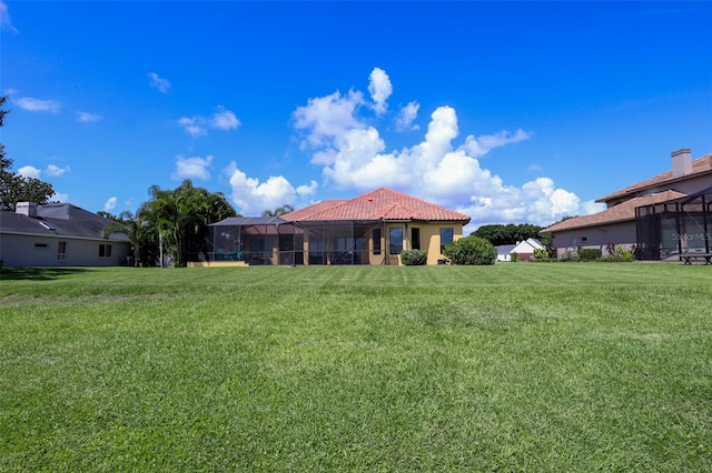 view of yard with glass enclosure