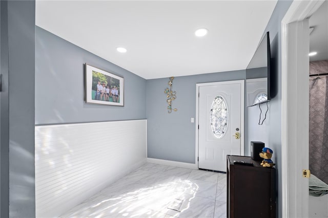 foyer entrance featuring recessed lighting, marble finish floor, and baseboards