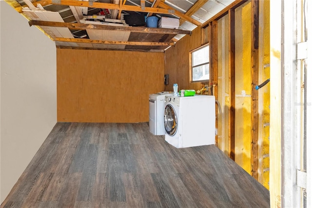 laundry room featuring dark wood-type flooring, laundry area, and separate washer and dryer