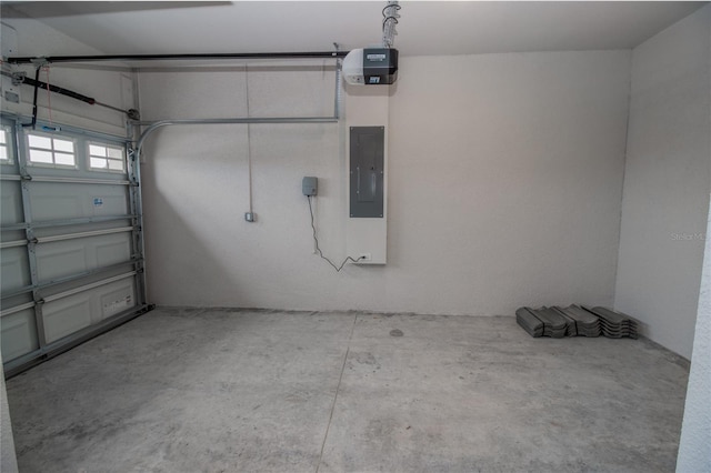 garage with electric panel and a garage door opener