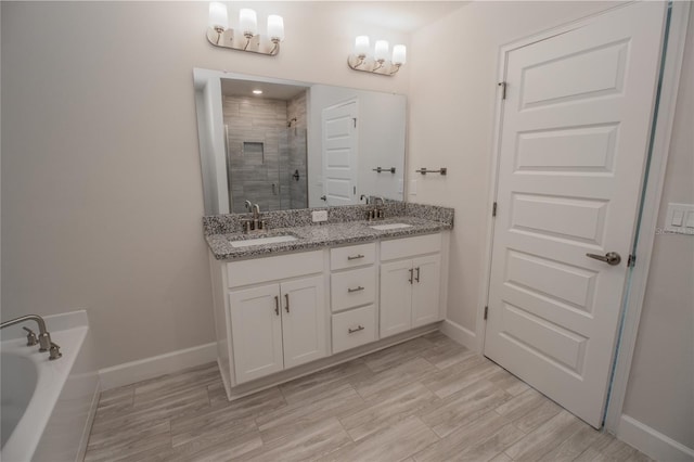 bathroom with independent shower and bath and double vanity