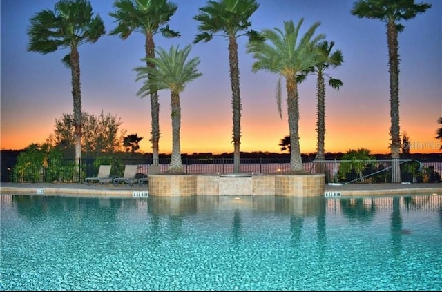 pool featuring fence