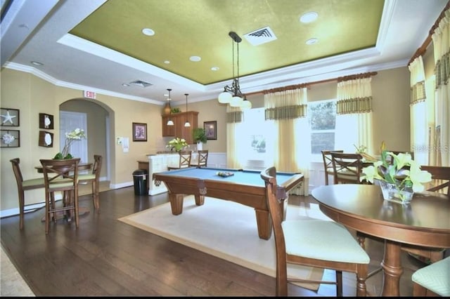 rec room with crown molding, pool table, dark hardwood / wood-style flooring, and a raised ceiling