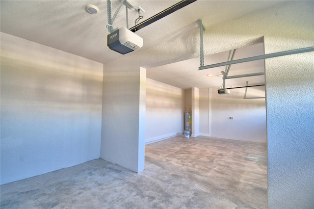 garage with water heater and a garage door opener