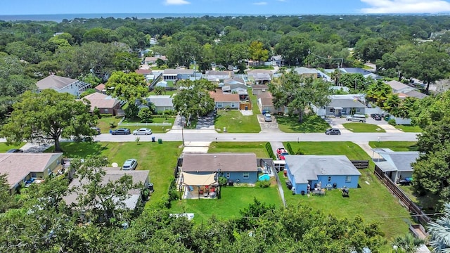 birds eye view of property with a wooded view and a residential view