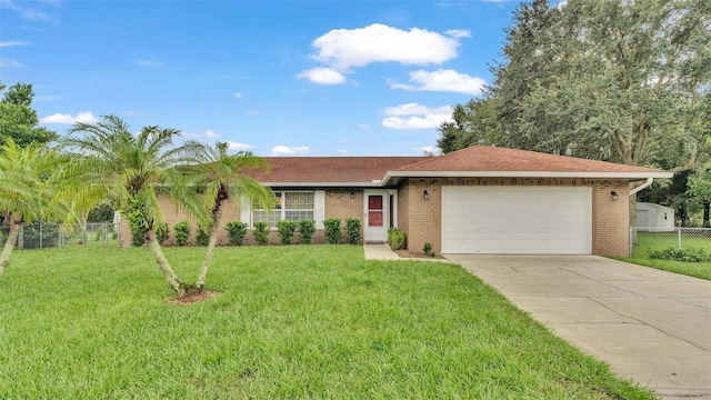 ranch-style home featuring a front lawn and a garage