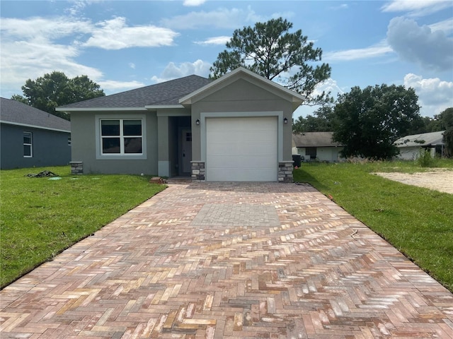 view of front facade with decorative driveway, a front yard, an attached garage, and stucco siding