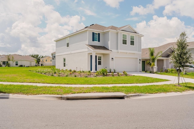 view of front facade with a front yard and a garage