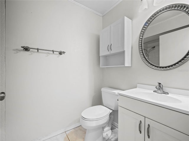 bathroom with crown molding, baseboards, toilet, tile patterned floors, and vanity