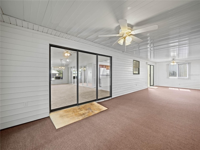 empty room with carpet floors and ceiling fan