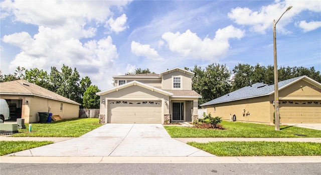 front of property with a garage and a front lawn