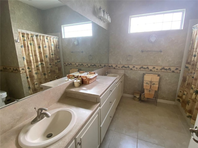 bathroom with vanity, toilet, and tile patterned flooring