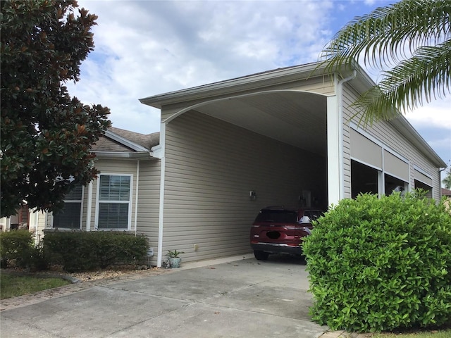 view of side of home featuring a carport