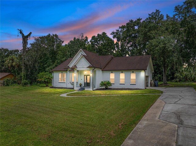 view of front of home with a lawn