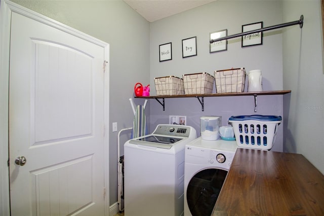 laundry area with laundry area and separate washer and dryer