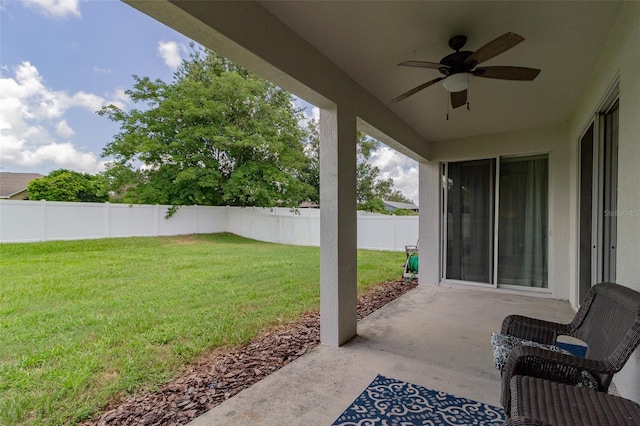 view of patio with a fenced backyard and ceiling fan