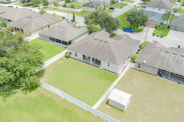 birds eye view of property with a residential view