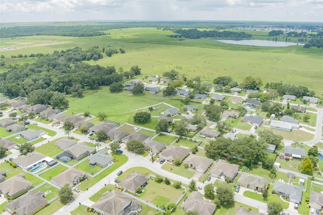 birds eye view of property featuring a water view and a residential view