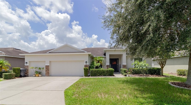 view of front of property with concrete driveway, stone siding, an attached garage, a front lawn, and stucco siding