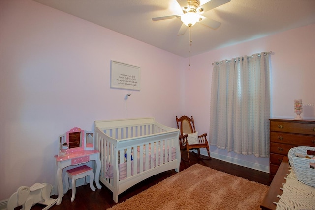 bedroom with ceiling fan and wood finished floors