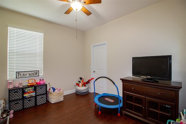 game room featuring ceiling fan, wood finished floors, and baseboards