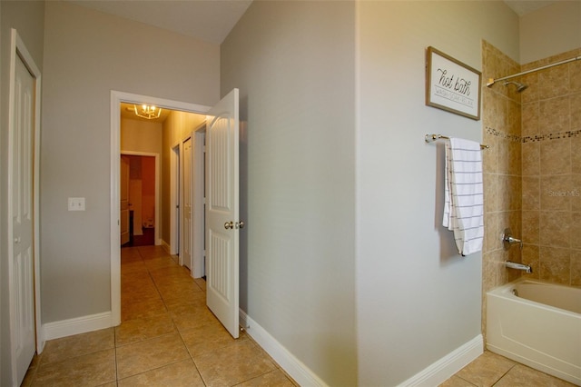 full bathroom featuring bathtub / shower combination, baseboards, and tile patterned floors