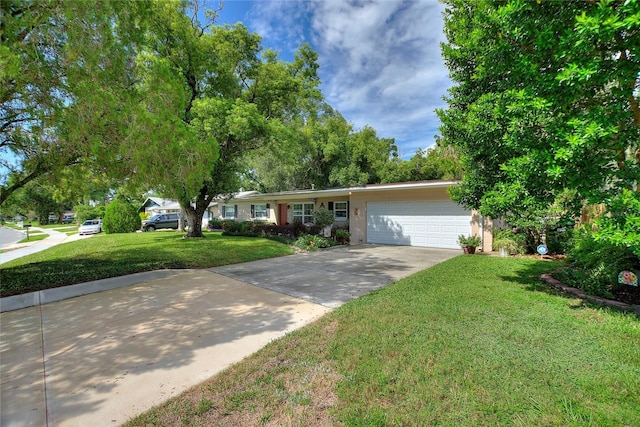 ranch-style home featuring a garage and a front yard