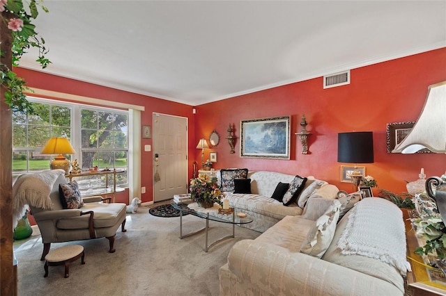 living room featuring ornamental molding and carpet flooring