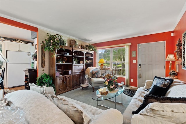 living room featuring crown molding