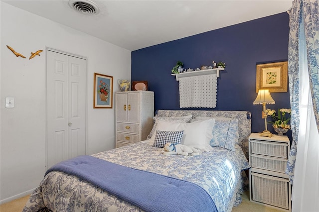 bedroom with a closet and carpet floors