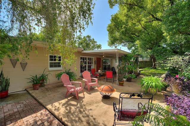 view of patio / terrace with a fire pit