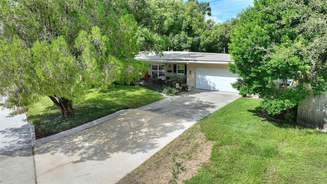 ranch-style house with a garage and a front lawn