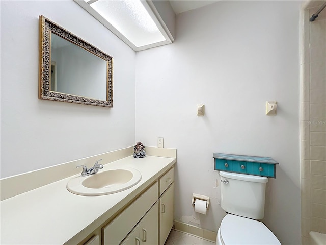 bathroom with toilet, baseboards, and vanity