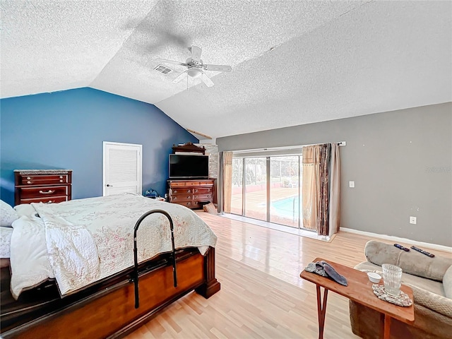 bedroom with visible vents, light wood-style floors, a ceiling fan, vaulted ceiling, and access to outside