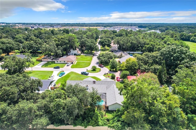 aerial view with a residential view and a view of trees