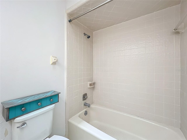 full bathroom featuring washtub / shower combination and toilet