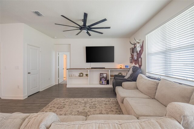 living room with ceiling fan and hardwood / wood-style flooring