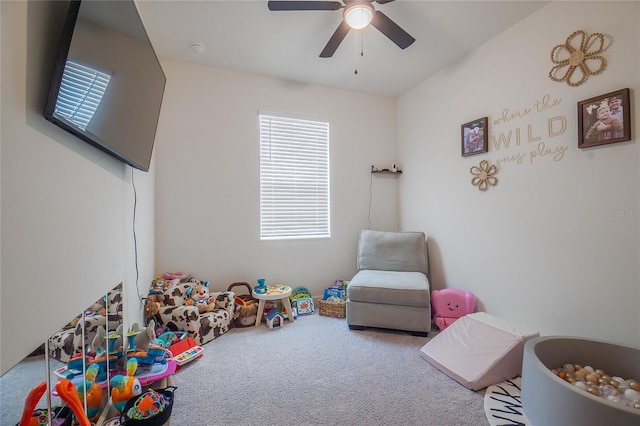 recreation room featuring ceiling fan and carpet